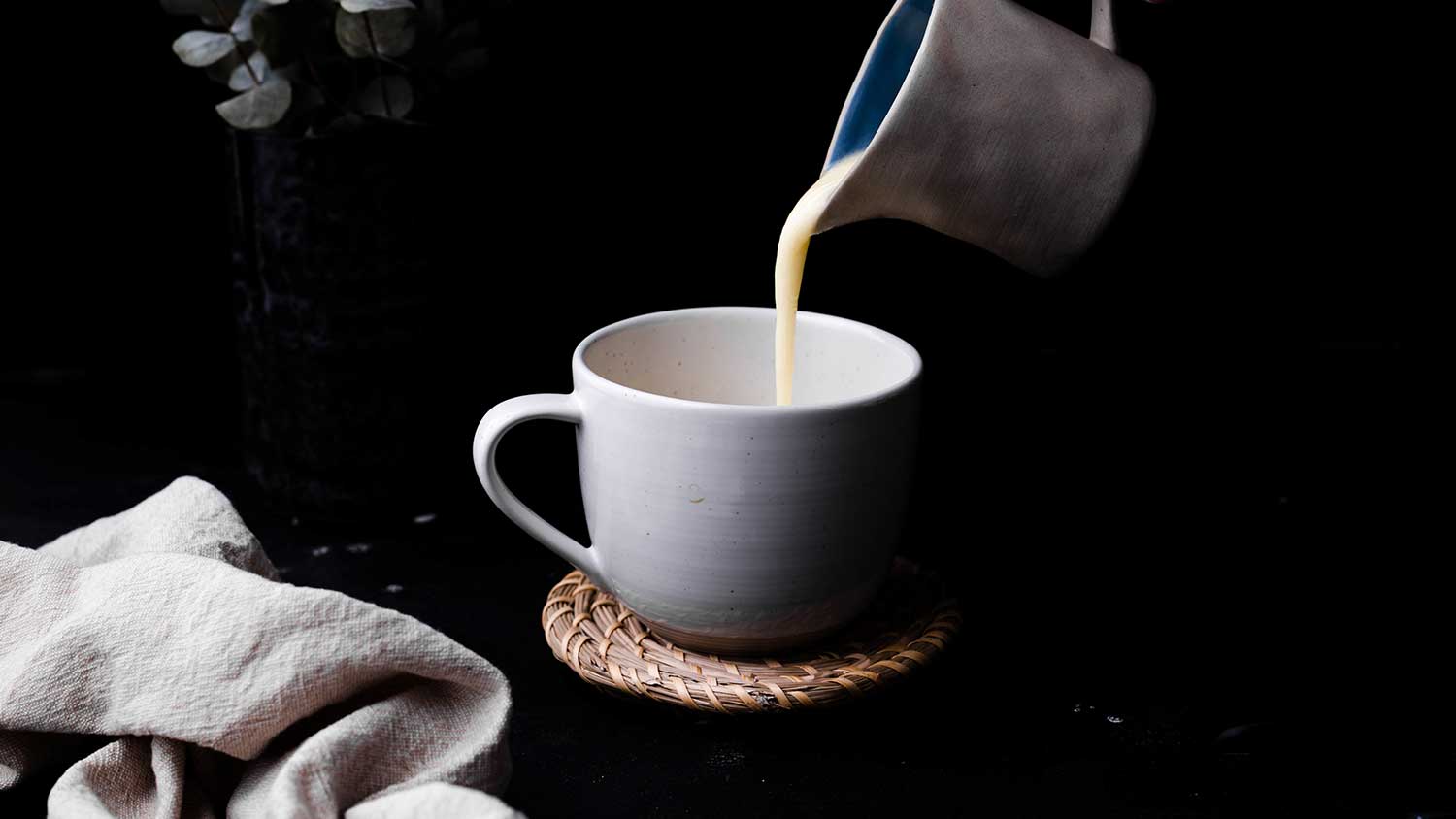 Hemp cream pouring into mug